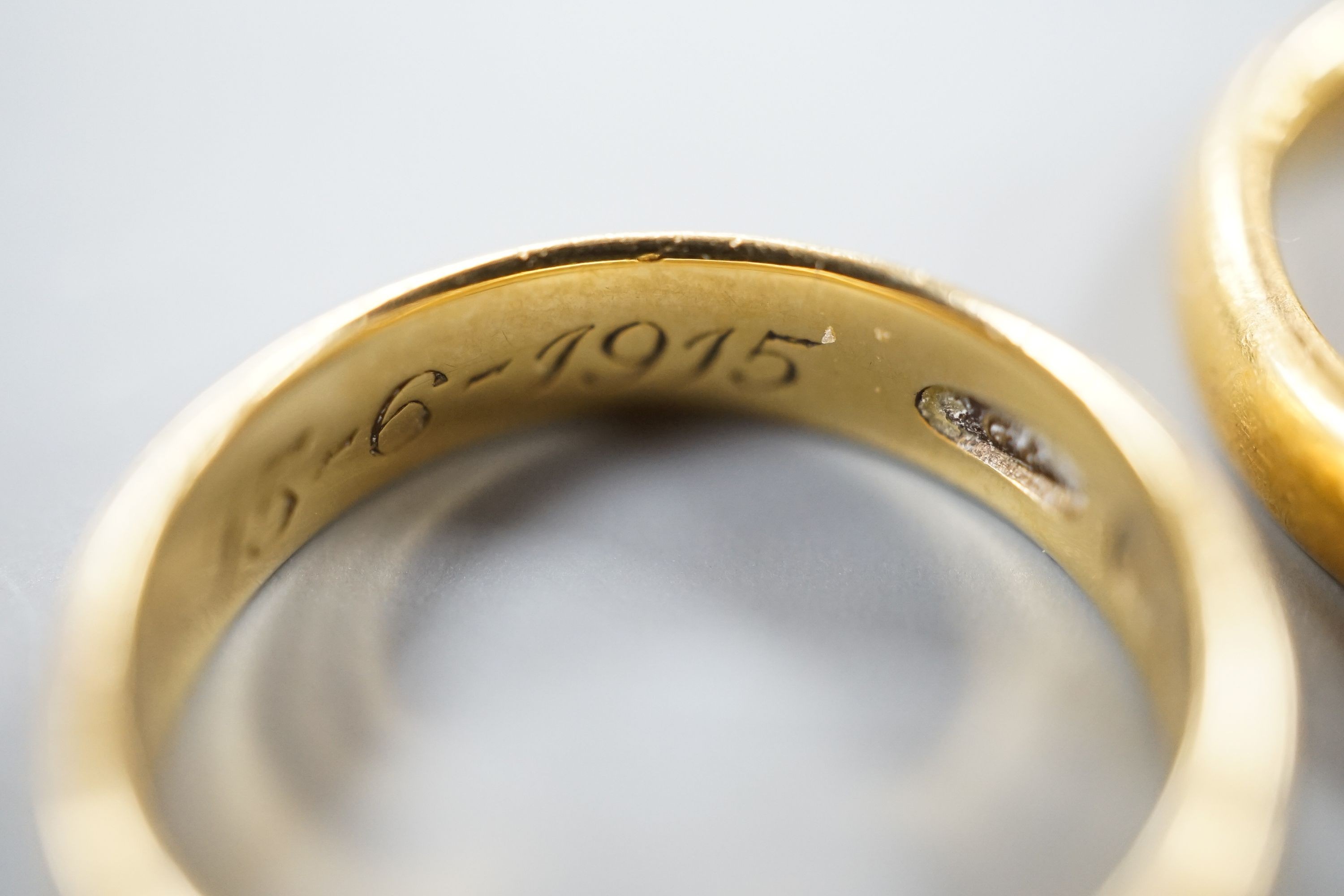 Two 22ct gold wedding bands, 10.3 grams, a George V 18ct gold wedding band and a Victorian 18ct gold shank, 6.6 grams.